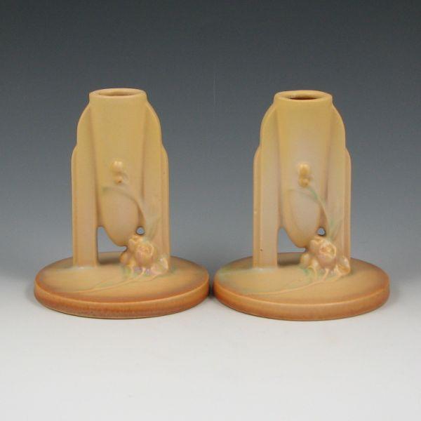 Pair of yellow Roseville Ixia candleholders.