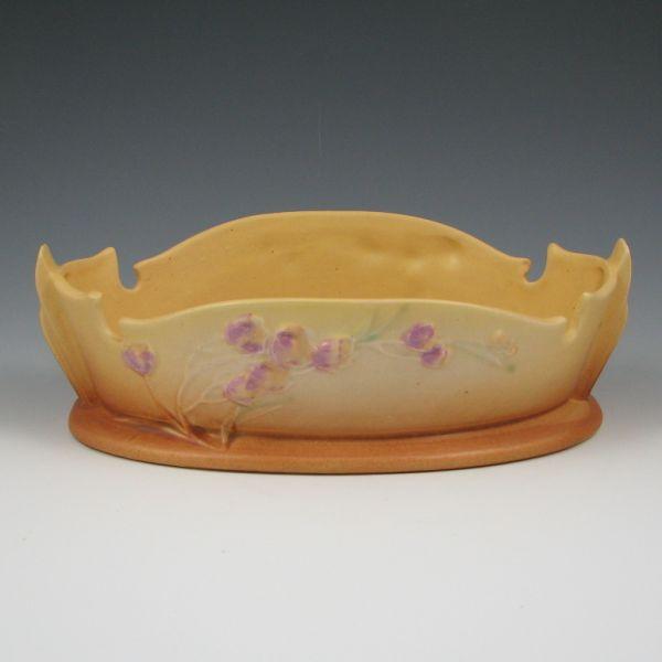 Roseville Ixia bowl in yellow and brown.