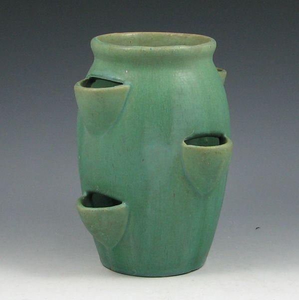 Matte green stoneware strawberry pot.