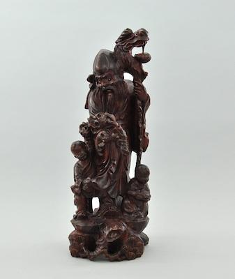 An Oriental Carved Wood Figural