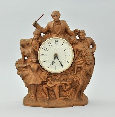 A Vintage Figural Clock A cast metal