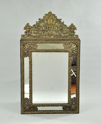 A Continental Brass Repousse Mirror,