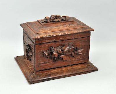 A Black Forest Carved Wood Cigar Box