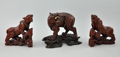 A Group of Three Carved Wooden