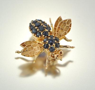 A 14k Gold and Blue Sapphire Fly