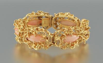An 18k Gold and Angel Skin Coral b4757