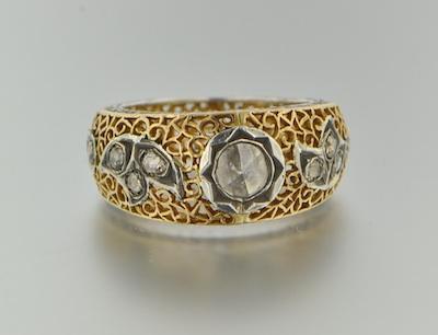 An 18k Yellow and Gold Ring With