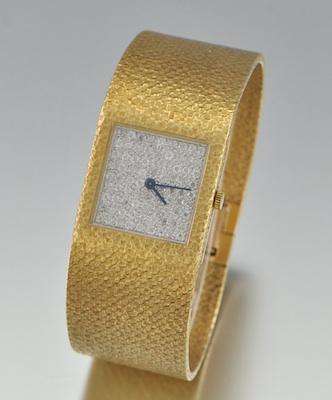 An 18k Gold and Diamond Watch by