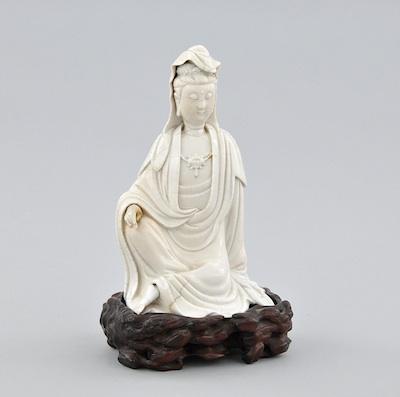 A Blanc De Chine Quan Yin on Stand