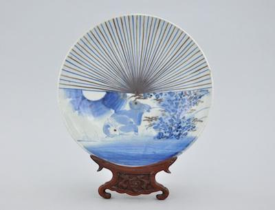 A Japanese Glazed Ceramic Dish on Stand