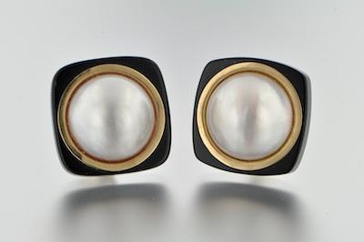 A Pair of Mabe Pearl and Onyx Earclips