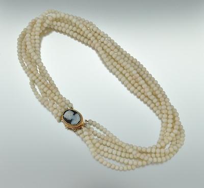 A Multi Strand Necklace with Carved b4f10