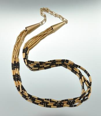 A Signed Horn Beads and 14k "Liquid"