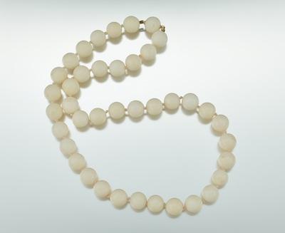 A Strand of White Coral Beads 39
