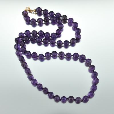 A Fine Amethyst Bead Necklace Carved