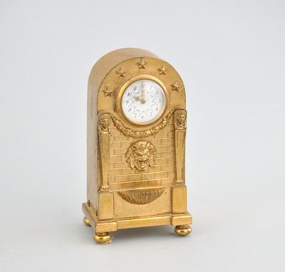 A French Empire Gilt Brass Clock  b4fbf