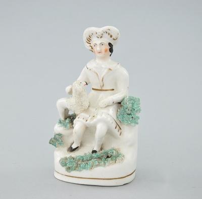 A Staffordshire Figural Seated Figure