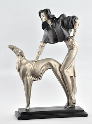 A Cast Metal Sculpture of a Woman