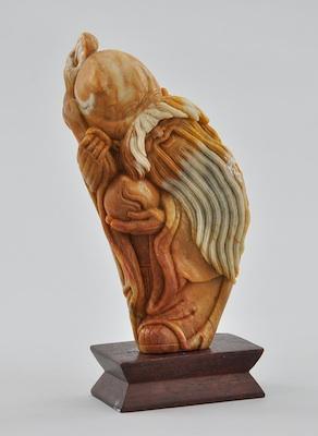 A Carved Hardstone Figural of the God