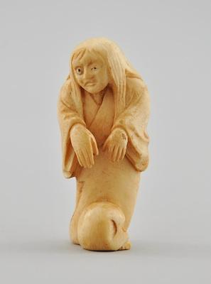 A Carved Ivory Netsuke The carved