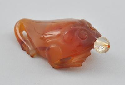 A Carved Amber Agate Three Toed b5c78