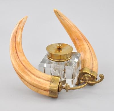 A Heavy Glass Inkwell with Brass Mounts