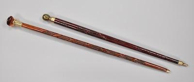 Two Carved Wood Walking Sticks b5cdd