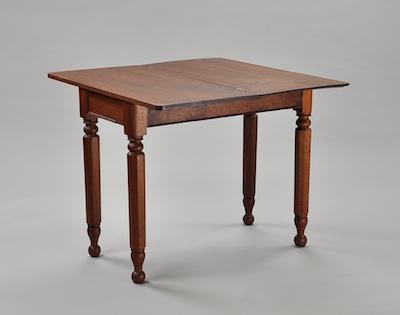 A Walnut Flip Top Game Table With