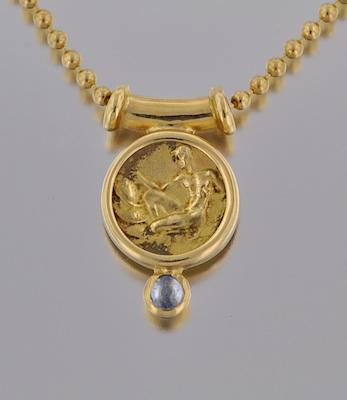 An 18k Gold and Sapphire Pendant