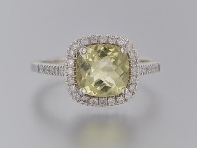 A Ladies Diamond and Peridot Ring b5aee