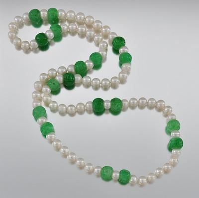 A Carved Jadeite Bead and Pearl
