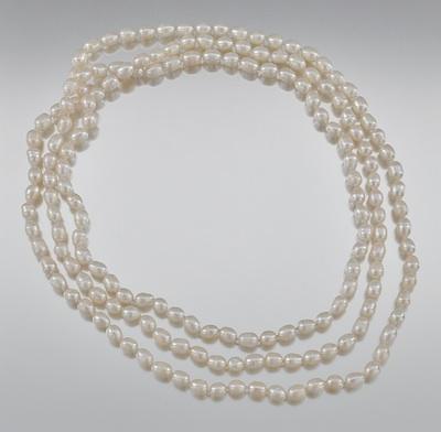 An Opera Strand of Oval Freshwater Pearls