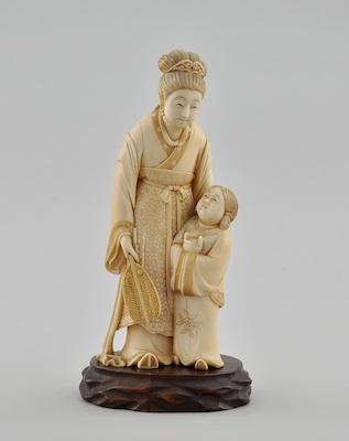 A Carved Ivory Figurine of a Woman b5b90