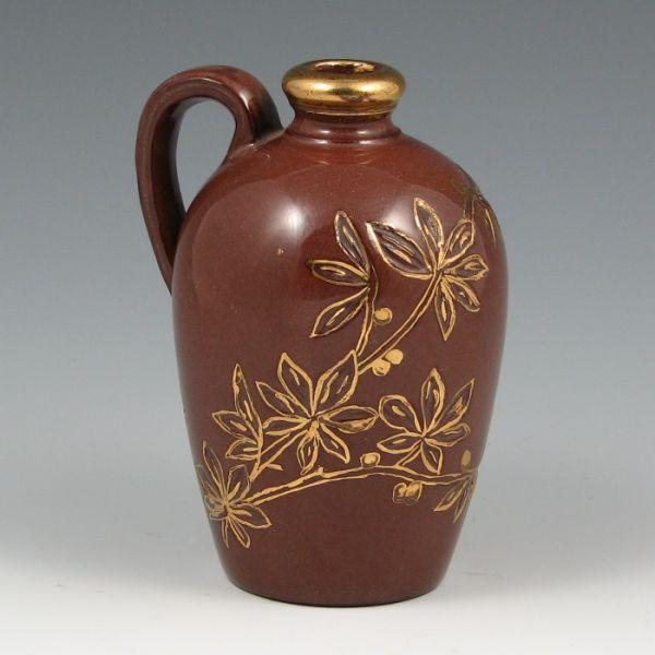 Cute perfume jug with carved berry