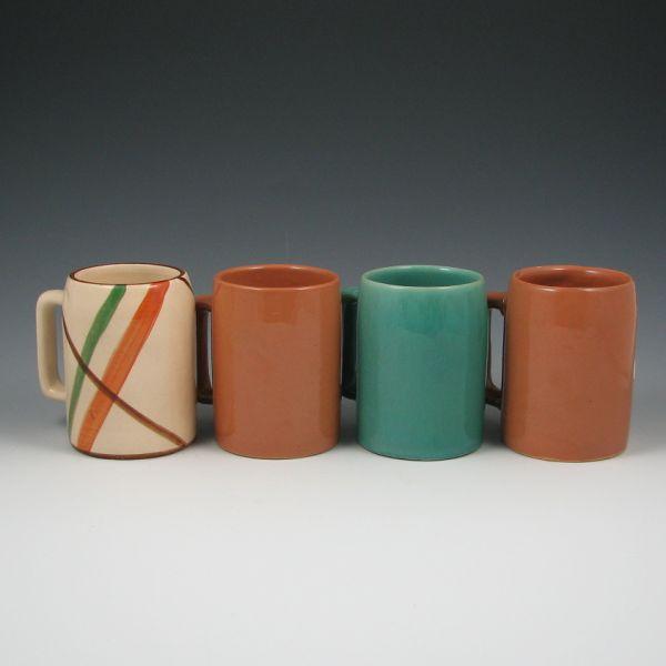 Four Weller coffee mugs in various