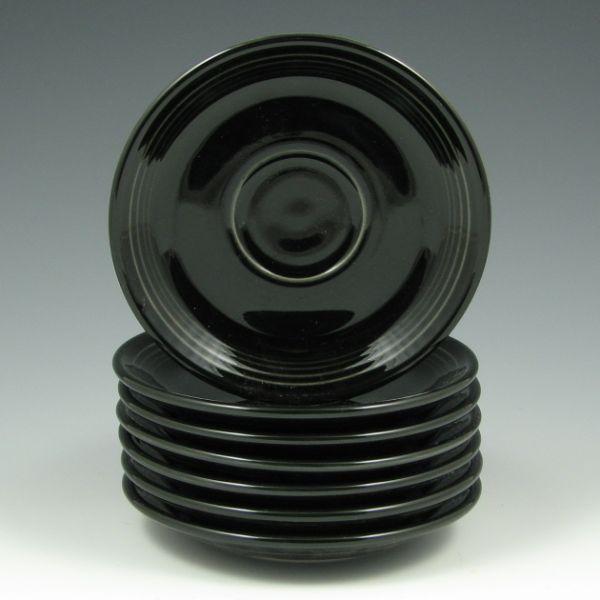 Seven (7) Fiesta saucers in Black.