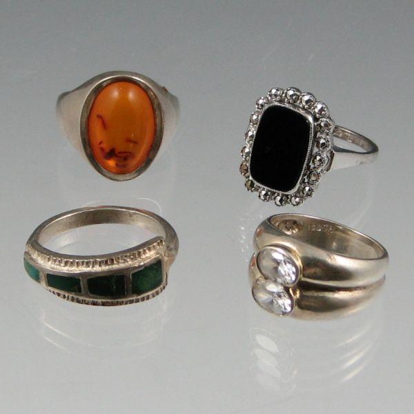 Four (4) sterling silver rings