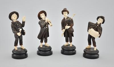 Four Carved Wood and Bone Figurines