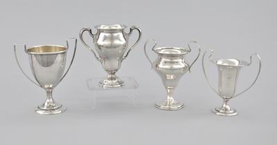 Four Miniature Sterling Silver Trophy