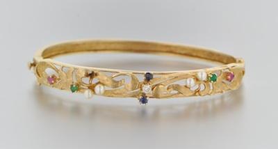 A 14k Gold and Gemstone Set Bangle b64e9