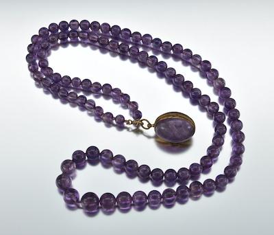 A Carved Amethyst Bead Necklace b6515
