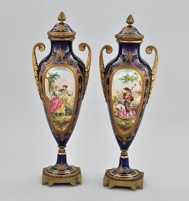 A Pair of French Lidded Urns with b6628