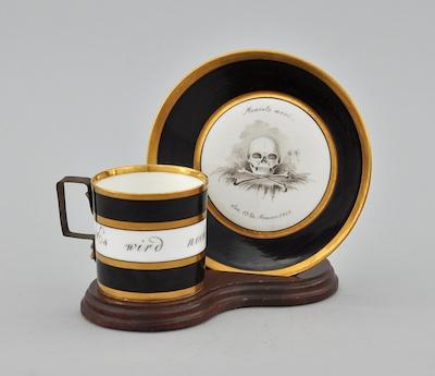 A Porcelain Memento Mori Cup b662e