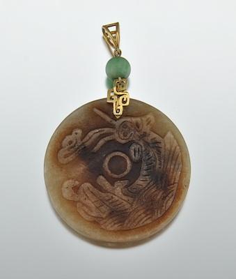 A Carved Jade Disk Pendant with