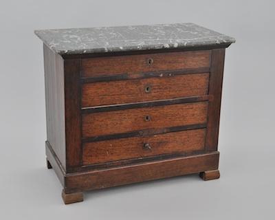 A Small Scale Wood Chest of Drawers