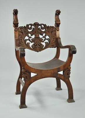 A Carved Wood Arm Chair With Serpent