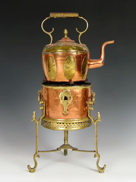 EARLY BRASS AND COPPER KETTLE ON