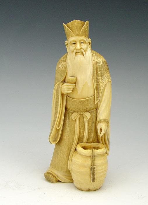 CARVED IVORY FIGURE OF A WISE MAN: