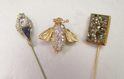 THREE GOLD PINS INCLUDING DIAMOND b8152