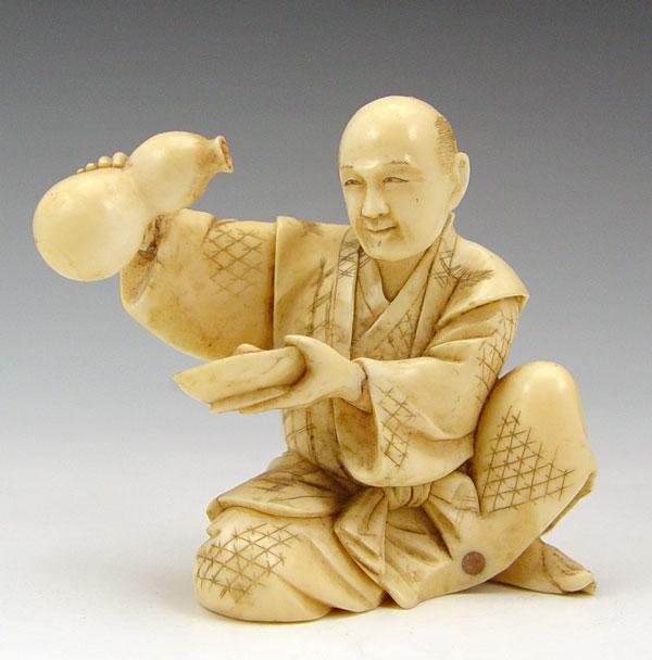 CHINESE CARVED FIGURE MAN POURING